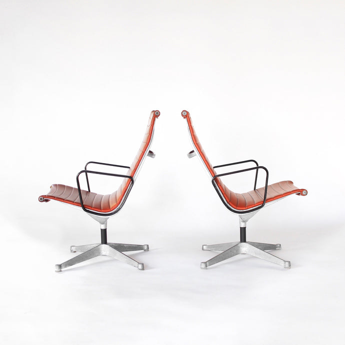 Early Eames Group Aluminum Lounge Chairs for Herman Miller - a Pair in Red